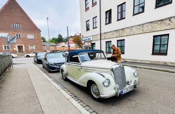 Augsburg, Germany - September 15th - 2023: Mercedes Benz Oldtimer 220 Cabrio parked on a public street.