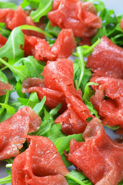 Slices of carpaccio with ruccola