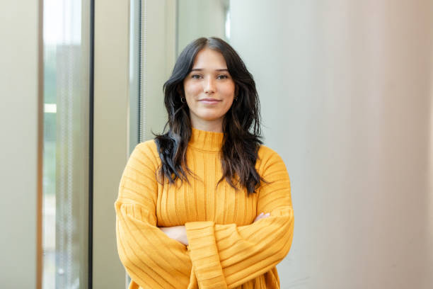 Successful young adult female college student poses for headshot - fotografia de stock