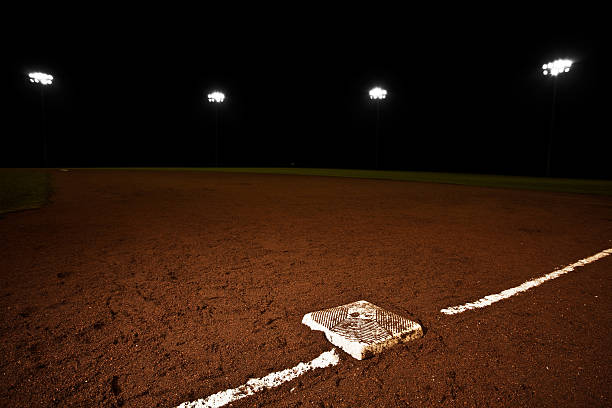 istock A baseball field at night with some lights on 168269986