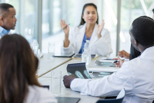 istock Diverse specialists meet for multidisciplinary meeting about patient 1682700142
