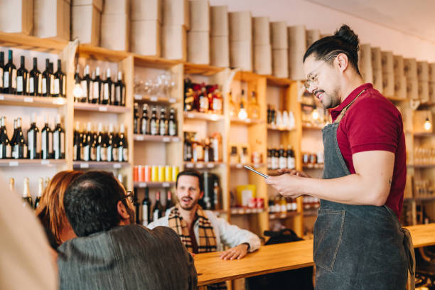 istock Waiter taking customers' order at restaurant 1682701822