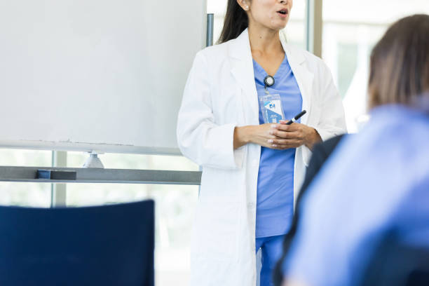 istock Unrecognizable female professor lectures unrecognizable medical interns 1682710083
