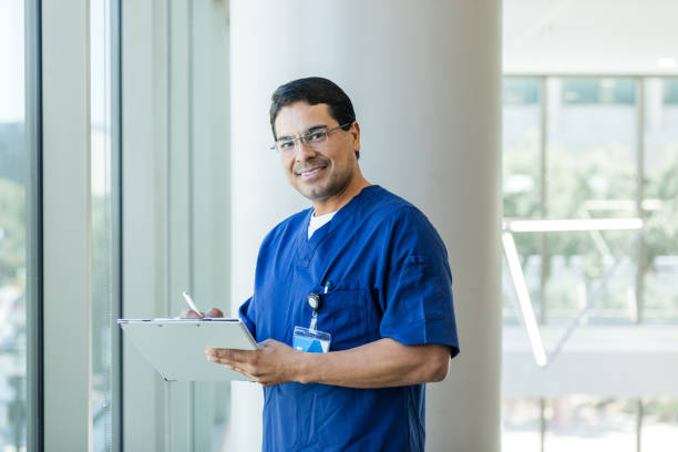 istock Successful, confident male surgeon does his rounds at hospital 1682711291