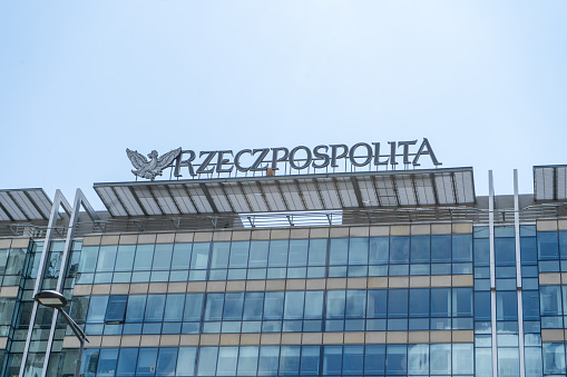 Building of Rzeczpospolitas headquarter in Warsaw. Rzeczpospolita office - Polish newspaper house. Logo brand. Street outdoor. Office entrance. Poland, Warsaw - July 27, 2023.