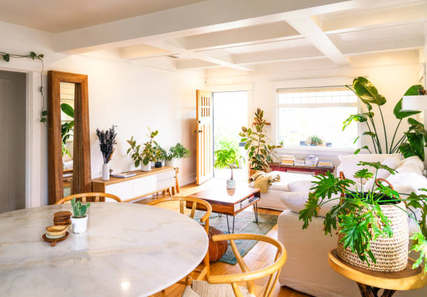 istock Modern open plan home interior with dining area in living room 1682713320