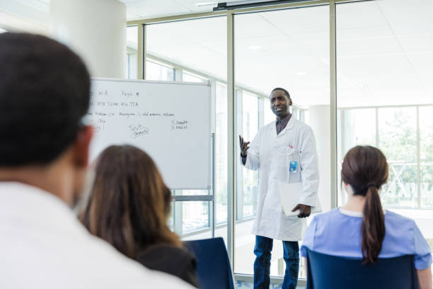 istock Doctor gestures while discussing patient's case during meeting 1682716796