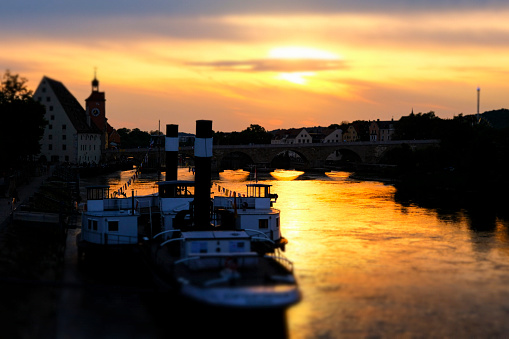 Sunset in Regensburg, view over the Danube to the \