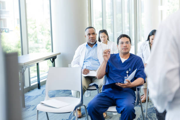 istock Doctor asking question during healthcare conference. 1682717922