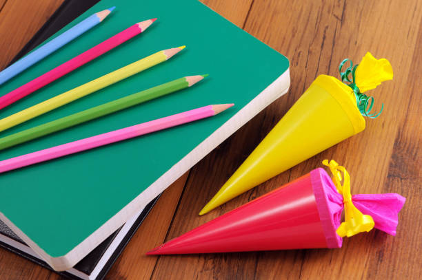 istock Conical bag of sweets with crayons work book school 168272120