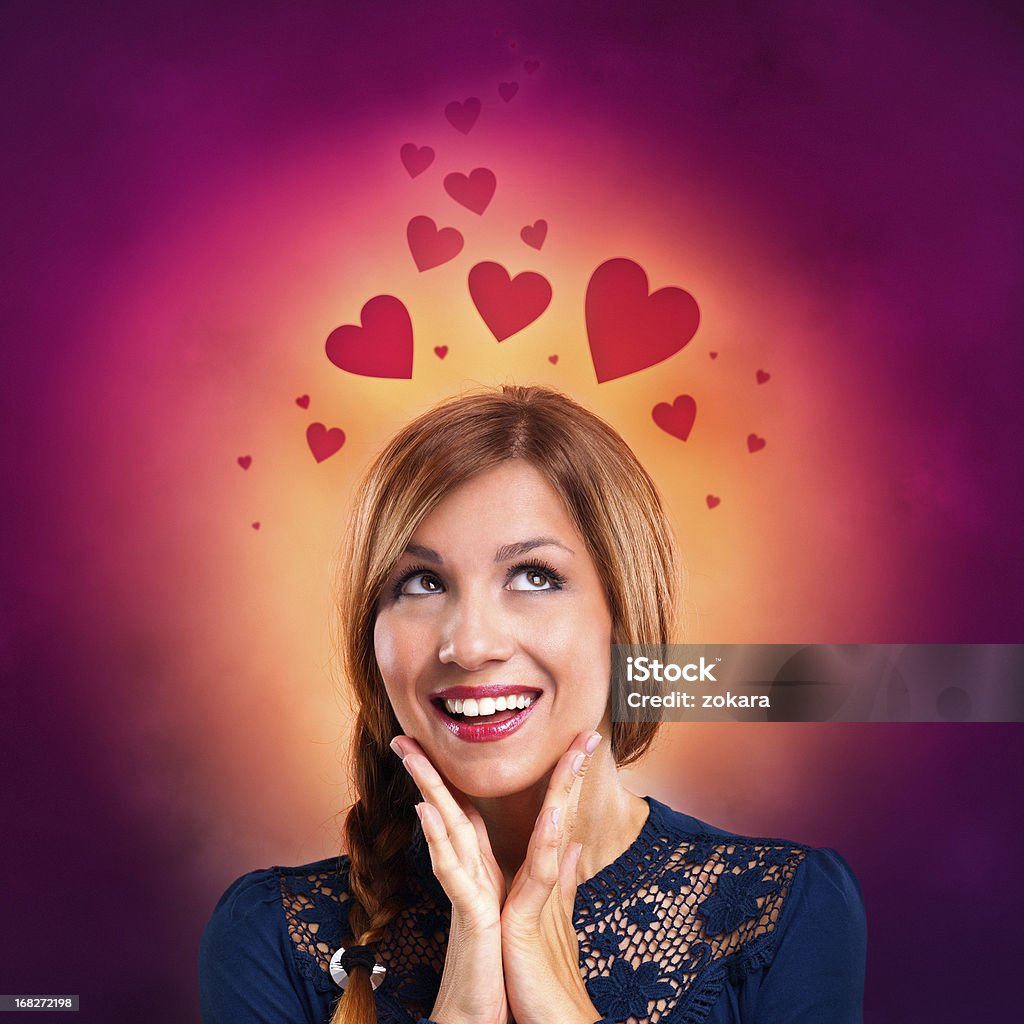 Young woman thinking loving thoughts Young women dreaming of love. Purple Stock Photo