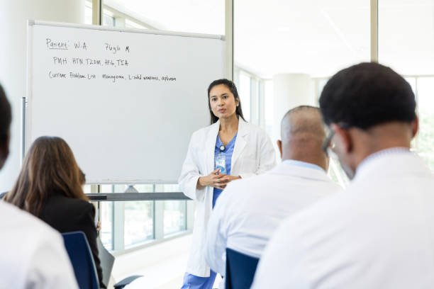 istock Doctor teaches continuing education seminar to diverse unrecognizable medical professionals 1682722792