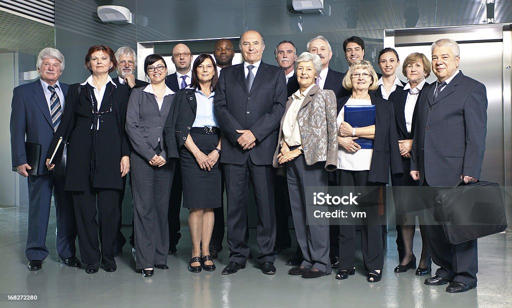 Grupo de empresarios posando - Foto de stock de Foto de grupo libre de derechos