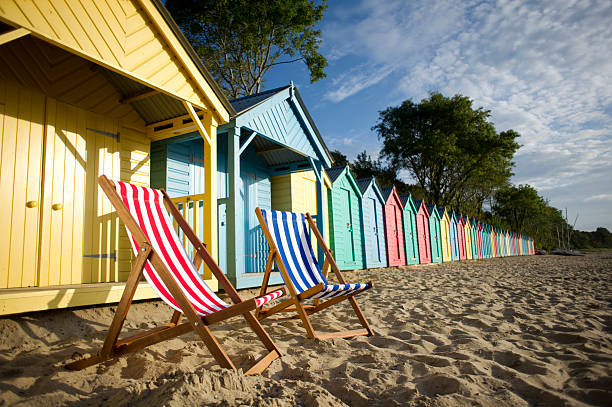 deckchair beach scene two stripey deckchairs  deck chair stock pictures, royalty-free photos & images