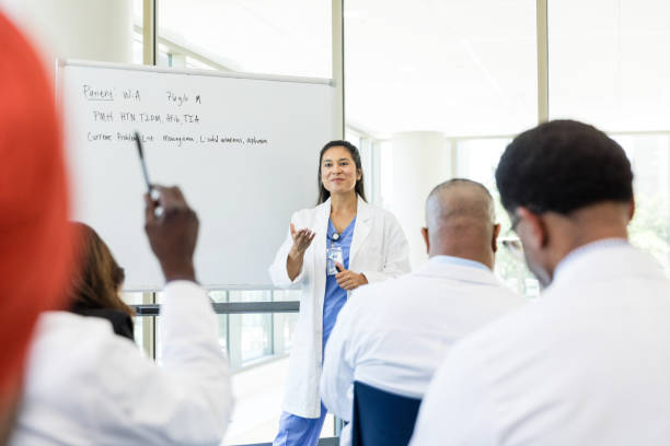 istock Unrecognizable male doctor raises his hand to ask a question 1682723906