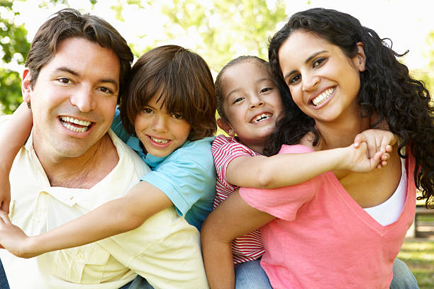 istock Young Hispanic Family Having Piggyback In Park 168273054