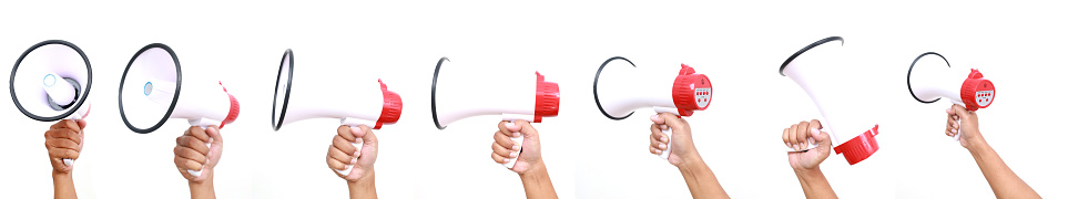 Man's Hand holds red white bullhorn megaphone set collection isolated background