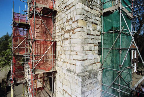 Sometimes maintenance works on artworks can be a nuisance for tourists. The image shows the Lendal Tower in York, England, during repair works in 2011. Red, Blue, Green primary colours.