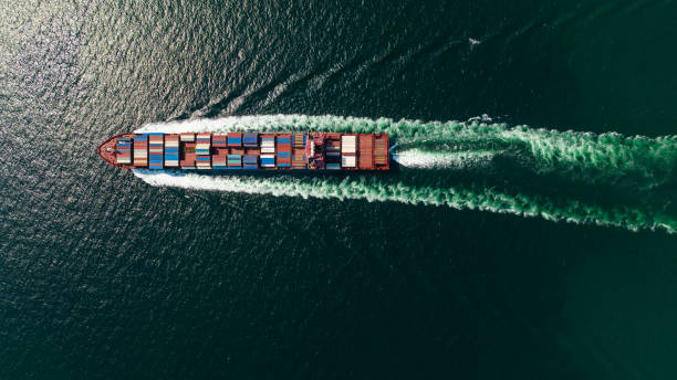 istock cargo container ship sailing full speed in sea to import export goods and distributing products to dealer and consumers worldwide, by container ship Transport, business logistic delivery service, aerial view 1682733302