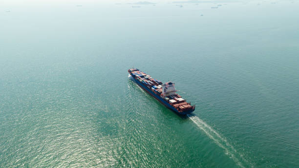 istock cargo container ship sailing full speed in sea to import export goods and distributing products to dealer and consumers worldwide, by container ship Transport business delivery service, aerial view 1682733306