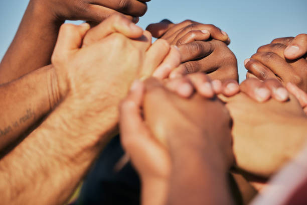 istock Closeup, teamwork and people holding hands, cooperation and support with empowerment. Diversity, group and friends with activity, strong together and motivation with union, human and collaboration 1682734390