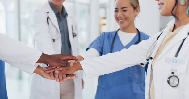 istock Doctors, hands or stack in teamwork, collaboration or motivation for healthcare, wellness or medical life insurance. Men, women or excited nurses in team building, support or solidarity in diversity 1682745779
