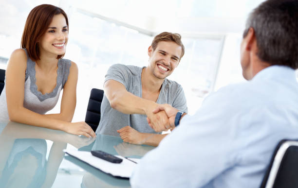 istock Young man shaking hands with financial adviser 168275330