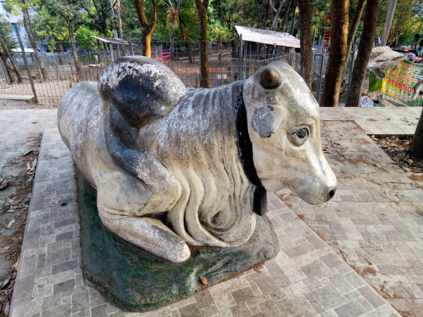 istock A white cow statue with a large body, a fooled pose 1682759232