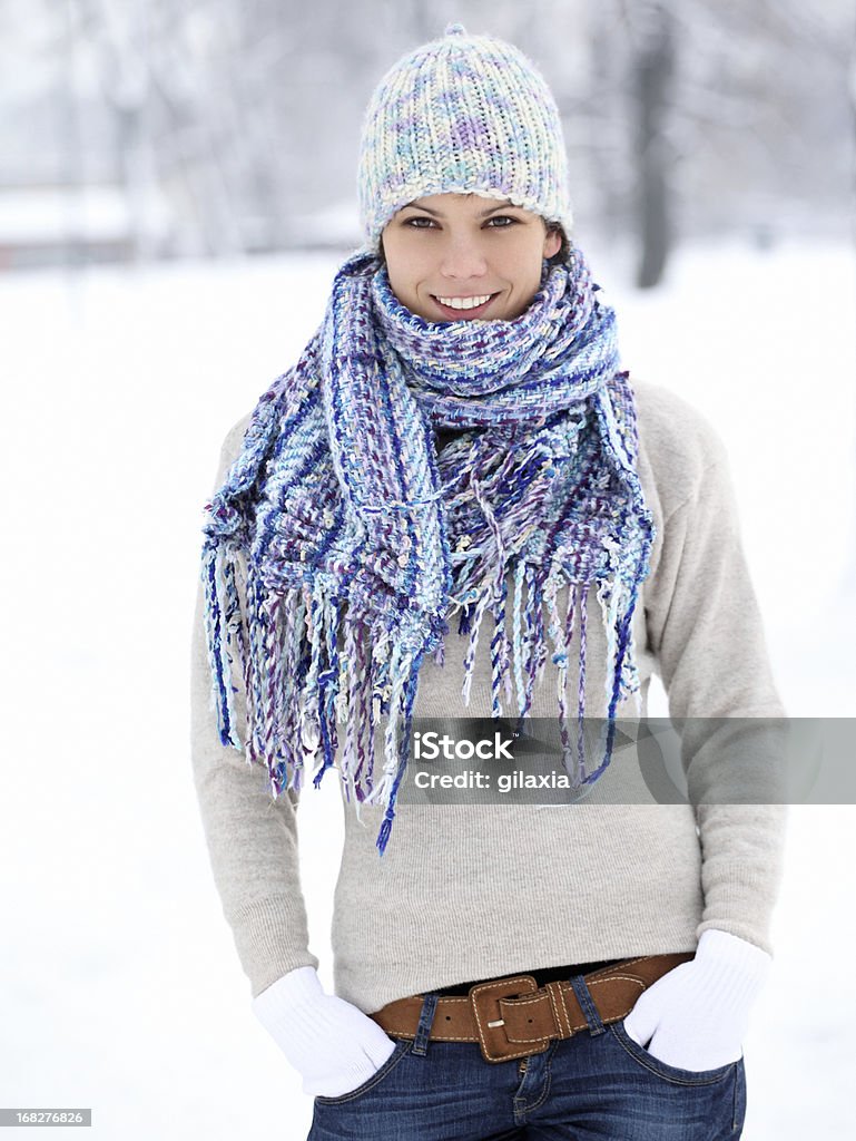 Young woman in park on a winter day. Portrait of young woman in park. Adult Stock Photo