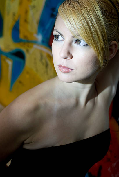 Young attractive blond woman with black dress  hochsteckfrisur stock pictures, royalty-free photos & images