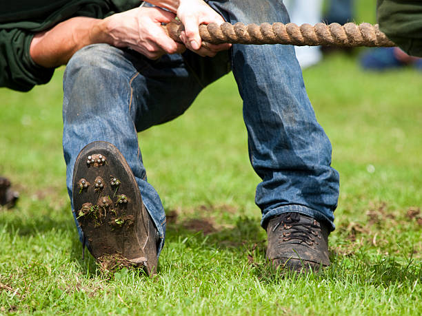 istock Man Pulling on Rope in Tug of War 168277075