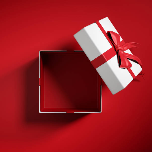 istock Top view of  open gift box or present box with red ribbon and bow  on red background with shadow 1682774112