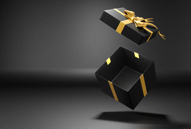 istock Open gift box or present box with gold ribbon and bow  on black background with shadow 1682774138