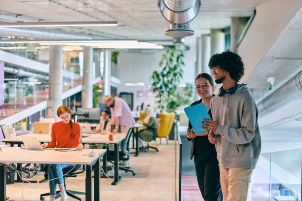 istock In a modern startup office, a diverse group of young professionals collaboratively tackles various business problems and challenges, surrounded by their engaged colleagues, fostering innovation and productivity 1682775790