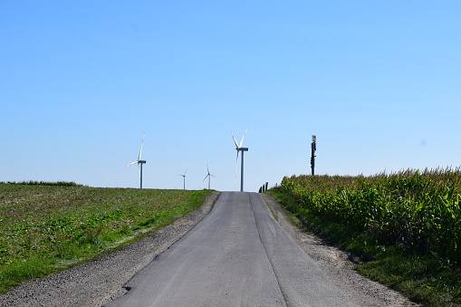 Düngenheim, Germany - 09/07/2023: dirt road to wind power plants