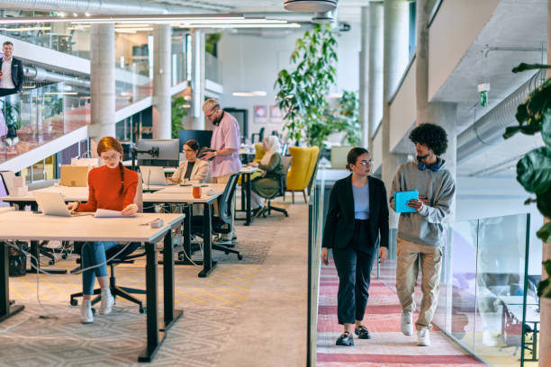 istock In a modern startup office, a diverse group of young professionals collaboratively tackles various business problems and challenges, surrounded by their engaged colleagues, fostering innovation and productivity 1682785927