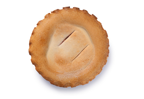 Overhead studio shot of a fruit pie cut out against a white background