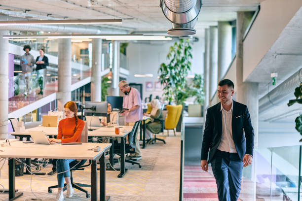 istock In a modern startup office, a diverse group of young professionals collaboratively tackles various business problems and challenges, surrounded by their engaged colleagues, fostering innovation and productivity 1682793125