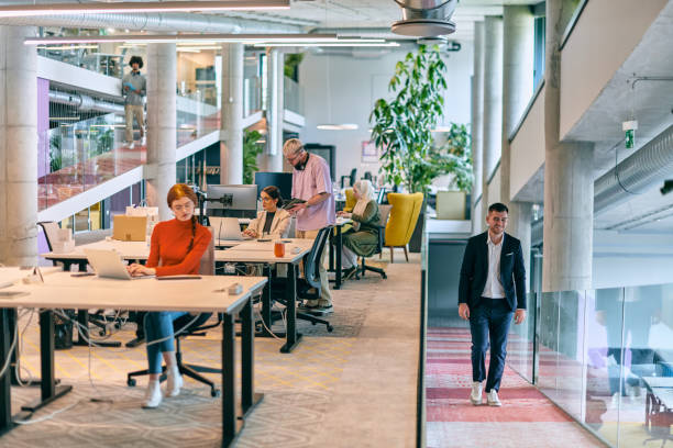 istock In a modern startup office, a diverse group of young professionals collaboratively tackles various business problems and challenges, surrounded by their engaged colleagues, fostering innovation and productivity 1682794779