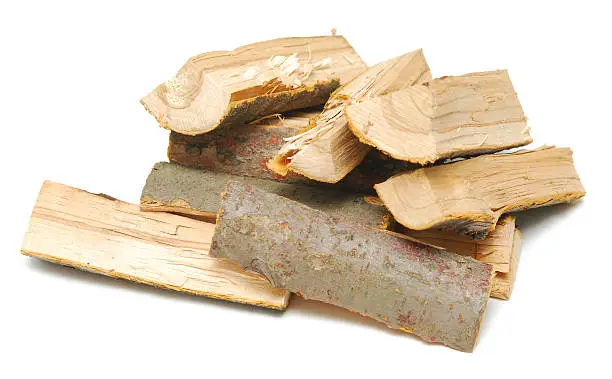 stack of firewood logs isolated on white