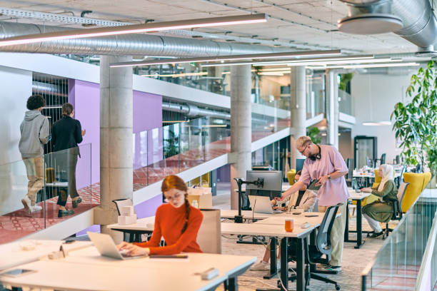 istock In a modern startup office, a diverse group of young professionals collaboratively tackles various business problems and challenges, surrounded by their engaged colleagues, fostering innovation and productivity 1682802612