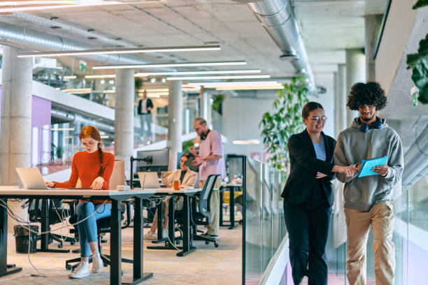 istock In a modern startup office, a diverse group of young professionals collaboratively tackles various business problems and challenges, surrounded by their engaged colleagues, fostering innovation and productivity 1682805301