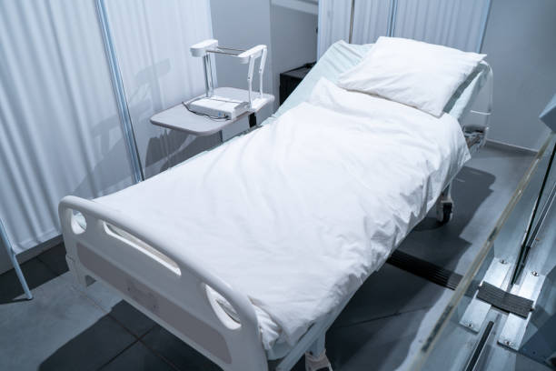 istock White bed in a hospital room. Blanket and pillow. 1682806413
