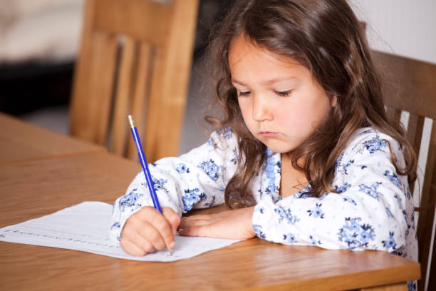 istock Little girl writing 168281202