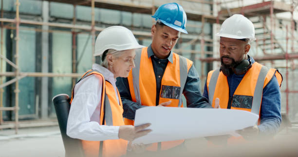 istock Construction site team, blueprint and architect collaboration on infrastructure, property development or civil engineering design. Teamwork, industrial illustration or group reading architecture plan 1682816958