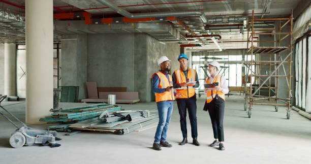 istock Construction team, collaboration and architect laugh at funny infrastructure, renovation or civil engineering plan. Comedy joke, humour or engineer group teamwork on architecture, project or strategy 1682817066