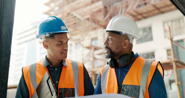 istock Men talking, planning and construction worker collaboration on infrastructure, property development or civil engineering design. Blueprint, architecture or partner conversation on real estate project 1682817079