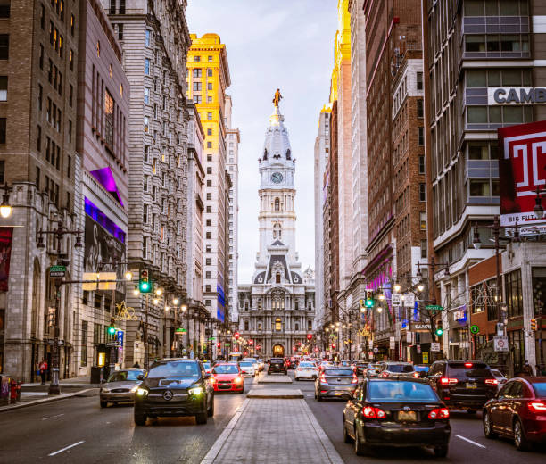 Philadelphia, USA - Busy evening traffic on Broad Street in downtown Philadelphia, with City Hall in the distance.