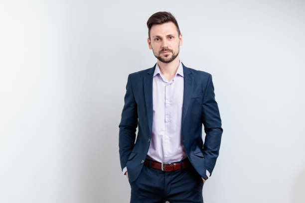 istock Confident young man in a dark blue suit 1682832772