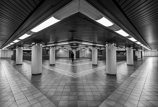 Germany, Berlin, September 08, 2023 - Rear view of man at underground walkway at subway station Berlin Siemensstadt Siemensdamm